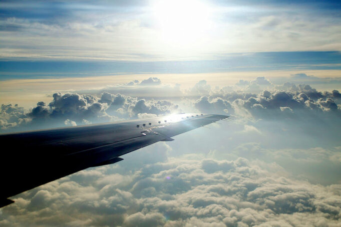 1920_webversion-wing-against-clouds-horizon